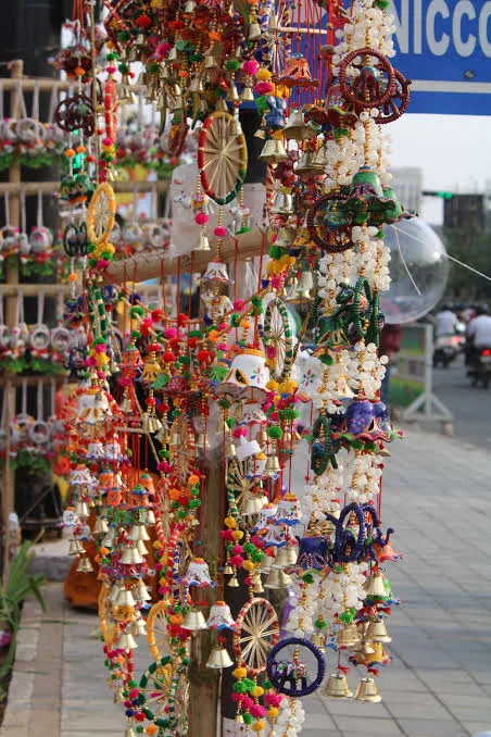 Brass bells and beaded door hangings at an Indian craft market